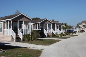 a row of houses on a street at Lake Magic Park Model 15 in Kissimmee