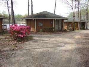a house with pink flowers in front of it at Lake Myers Lakeside Villa 16 in Mocksville