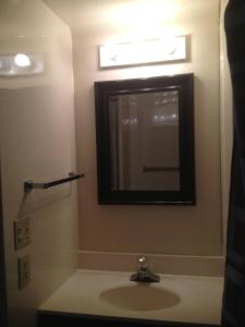 a bathroom with a sink and a mirror at Lake Myers Lakeside Villa 16 in Mocksville