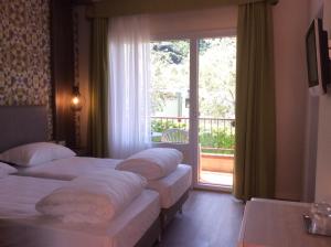 Postel nebo postele na pokoji v ubytování Hotel Anna