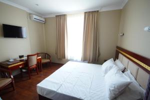 Postel nebo postele na pokoji v ubytování Hotel 725