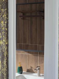 a bathroom with a sink with a mirror above it at White Beach Resort Longset in Koh Rong Island