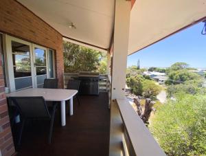 a balcony with a table and chairs and a view at Double View in Lancelin