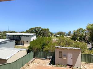 an aerial view of a building and a fence at Double View in Lancelin +2 photos