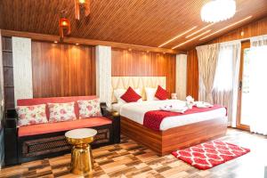 a bedroom with a bed and a bench in it at Le Karaj Meadows in Lovedale