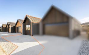 a row of houses in a row at Mountain Escape by Remarkables 9 | 2-bedroom unit in Frankton Wharf +4 photos