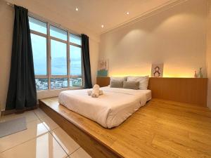 Giường trong phòng chung tại Ipoh Town Majestic Suites by IWH Suites +63 ảnh
