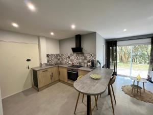 a kitchen with a table and a counter top at appartement Mondragon in Mondragon