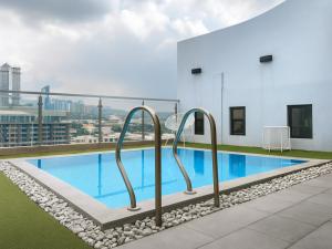 a swimming pool on the roof of a building at Castle Peak Hotel in Cebu City