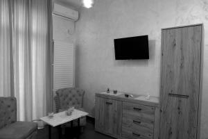 a living room with a television on the wall at Panorama - 1 Lazarevac in Lazarevac