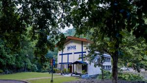 a building with a sign on the side of it at The Big Bridge- A Boutique Hotel On A Bridge in Rishīkesh
