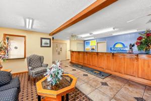 a lobby with a waiting room with a waiting table and chairs at Days Inn by Wyndham Lexington in Lexington +53 photos