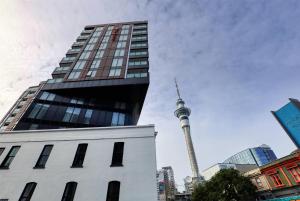 a view of the cn tower in a city at Ramada Suites By Wyndham Victoria Street West in Auckland