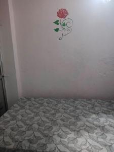 Postel nebo postele na pokoji v ubytování Royal Family Resturent