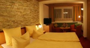 Letto o letti in una camera di Wanderhotel Grüner Baum