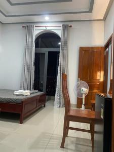 Ένα ή περισσότερα κρεβάτια σε δωμάτιο στο Motel Long Thành Quang