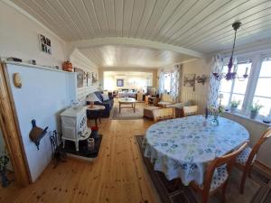 a large living room with a table and a living room at 6 person holiday home in Finnsnes-By Traum in Finnsnes