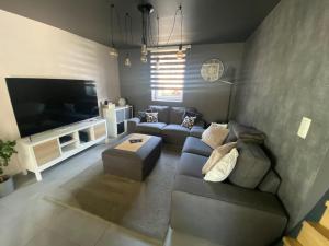 TV a/nebo společenská místnost v ubytování Chez Kri