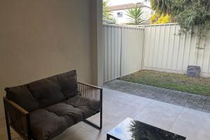 a living room with a couch and a table at Timeless Tranmere Escape By Host Solutions in Norwood