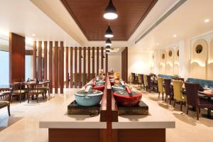 a restaurant with a table with boats on it at Best Western Plus Phagwara in Phagwāra