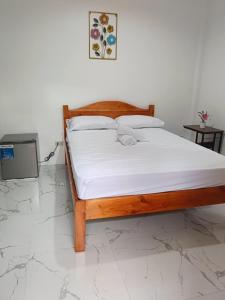 Ένα ή περισσότερα κρεβάτια σε δωμάτιο στο M&A Guesthouse