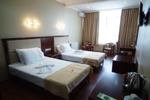 Postel nebo postele na pokoji v ubytování Hotel 725