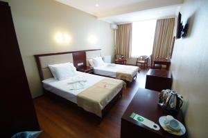 Postel nebo postele na pokoji v ubytování Hotel 725