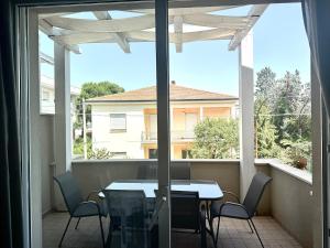 a patio with a table and chairs on a balcony at Duplex da sogno nella posizione migliore di Giulianova Lido in Giulianova +6 photos