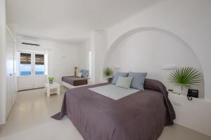 Postel nebo postele na pokoji v ubytování Capofaro Resort + 121 fotografií