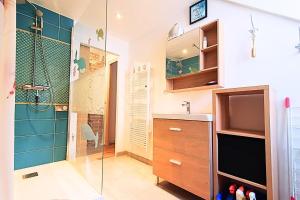 a bathroom with a shower and a sink at Spacious cocoon near the sea in Saint Malo