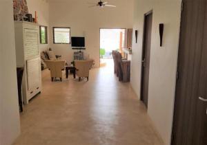 a living room with a kitchen and a dining room at Villa Caribbean Dream Bonaire in Kralendijk +65 photos