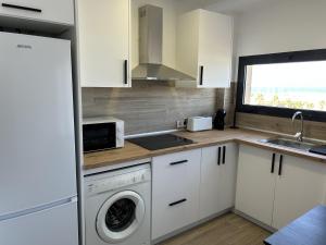 Køkken eller tekøkken på Marina Playa Apartamento