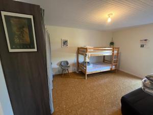 a bedroom with a bunk bed in a room at Sérénité Marais-Océan in Longeville-sur-Mer +9 photos