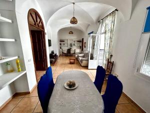a dining table and chairs in a living room at "Casa Grande"de Como En Casa in Don Benito