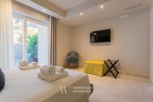 TV a/nebo společenská místnost v ubytování Wanderlust Experience Waves Lux Apartments