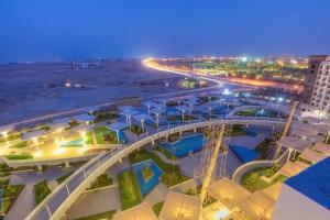an aerial view of a beach at night at elegant hotel studio Porto New Cairo pool access in Cairo