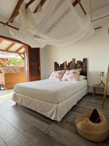 En eller flere senge i et værelse på Villa f oufou