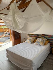 En eller flere senge i et værelse på Villa f oufou + 40 billeder