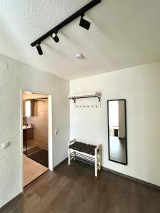 an empty room with a mirror and a bed in it at Ferienwohnung mit Dachterrasse in Selb +6 photos