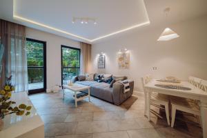 a living room with a couch and a table at Apartamenty Home Sweet Home in Szklarska Poręba