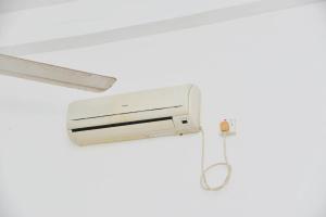 a security camera in a room with a white ceiling at Relax - Budget Rooms in Batapola in Batapola