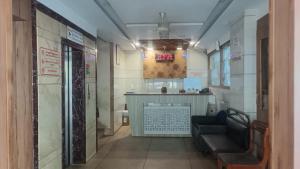 a long hallway with a bar in a room at Hotel Sabar inn in Ahmedabad