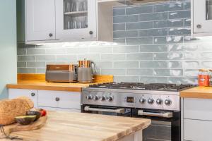 a kitchen with a stove and a counter top at Friargate House in York