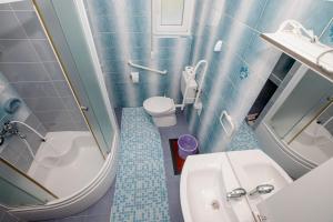 a small bathroom with a toilet and a sink at Eg Marjetka Bis 9 in Rab +31 photos