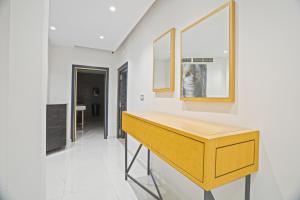 a kitchen with a wooden counter in a room at Hotel Donia Sfax in Sfax