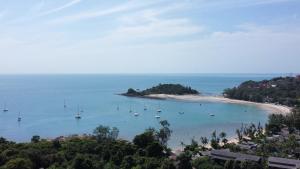 a view of a beach with boats in the water at villaSAMU in Amphoe Koh Samui