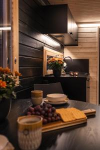 a kitchen with a table with food on it at Piilotupa in Inari