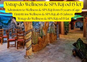 a picture of a restaurant with a sign that reads shop do wellness spa fab at Hotel Kocourkov in Hlinsko