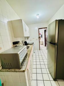 Η κουζίνα ή μικρή κουζίνα στο Apartamento caminho das praias