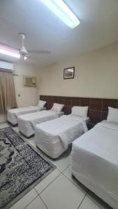 Postel nebo postele na pokoji v ubytování فندق أبراج الجنادرية